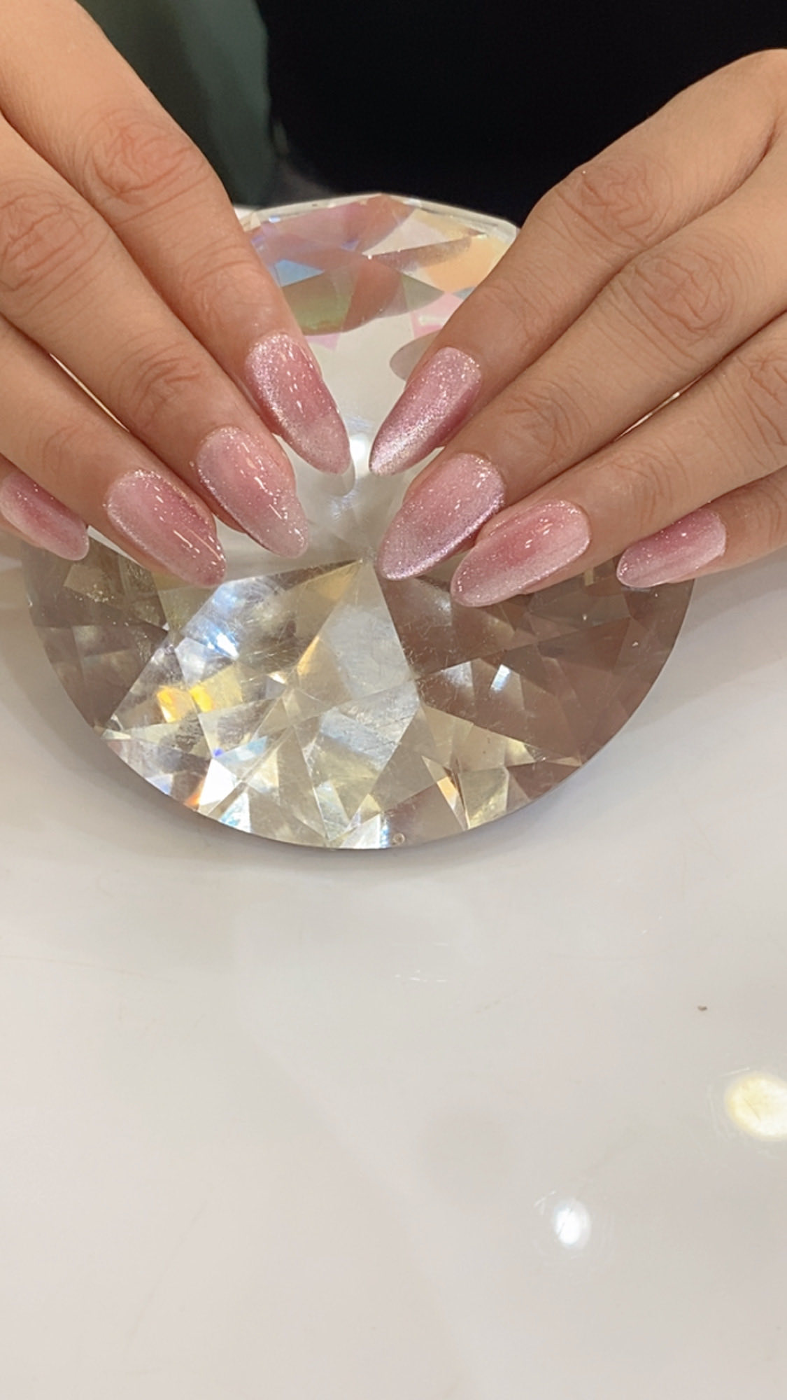 Pink shimmer gel nail extensions
